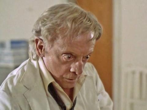 Still image from Patrick showing nurse Dr Roget, played by Robert Helpmann