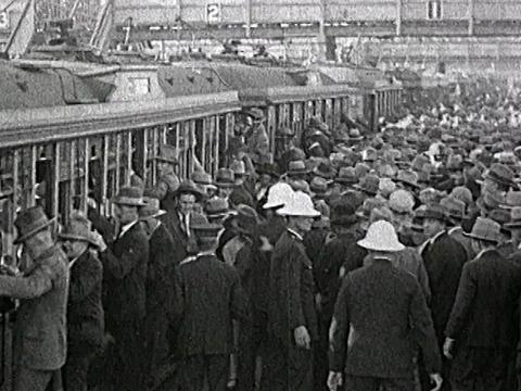 Crowds at Randwick Racecourse lining up to get on a tram. Circa 1928.