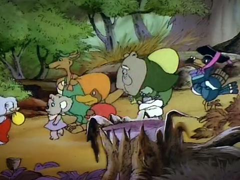 Still from the animated television show Blinky Bill's Fire Brigade, showing Blinky (a koala) and his animal friends, including a wombat, platypus, kangaroo, wallaby and others walking single file through the bush.