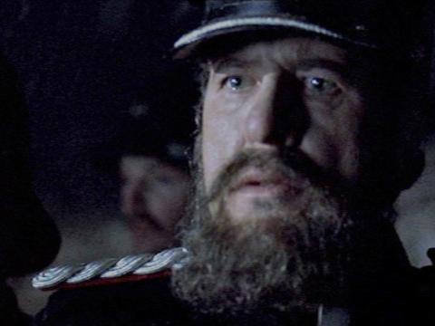 Superintendent Hare (played by Geoffrey Rush) and the officer to his left look stunned.