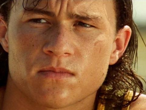 Heath Ledger as Jimmy in the film Two Hands. His face is in close-up and he looks sweaty and preoccupied. His long hair is wet.