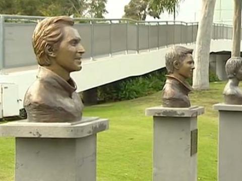 Bronze busts of Tood Woodbridge and Mark Woodforde on display in Garden Square in Melbourne Park