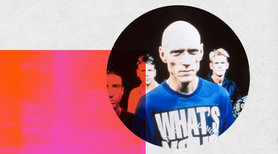 Peter Garrett, lead singer of Midnight Oil, surrounded by three band members.