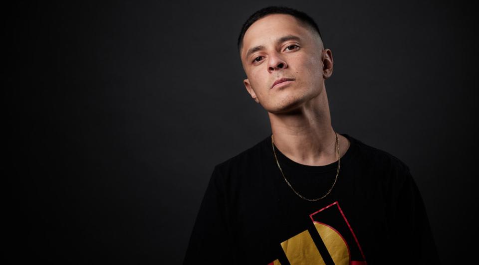 Rapper, drummer, composer and producer DOBBY wearing a black t-shirt