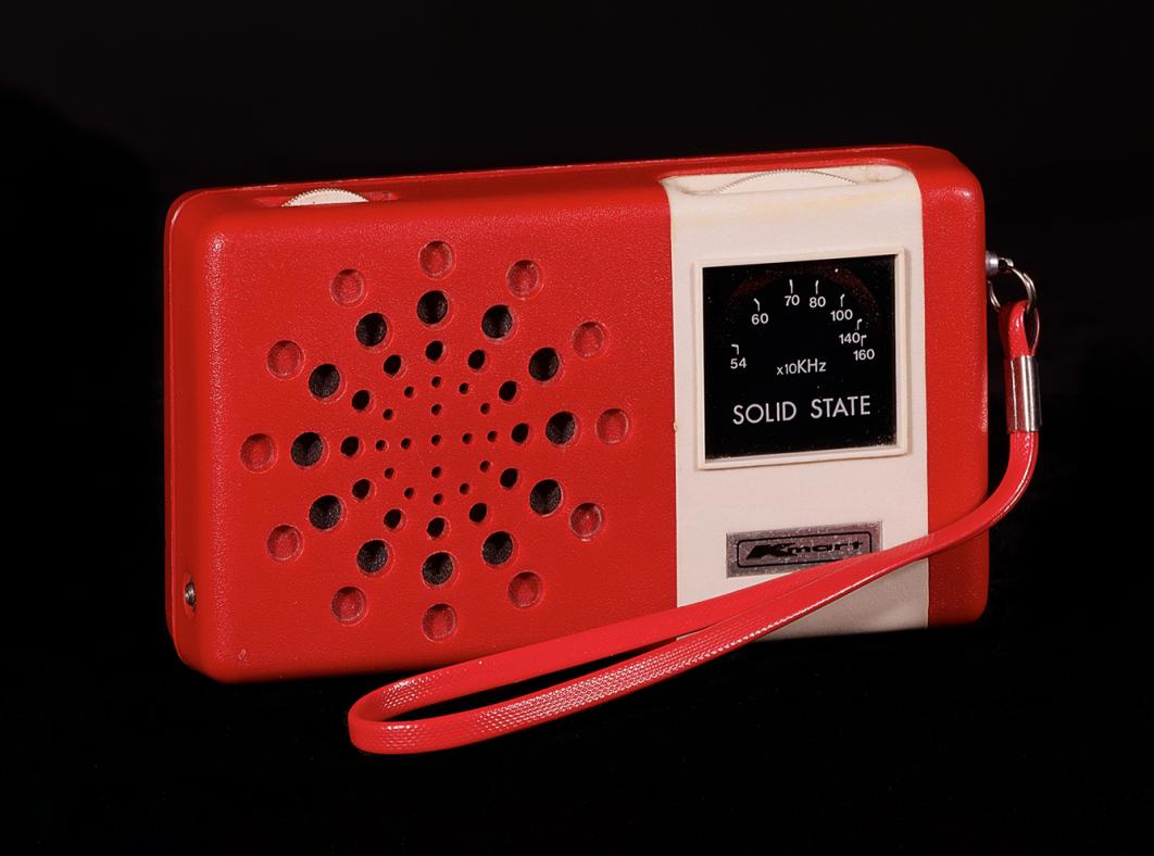 A red portable transistor radio. 