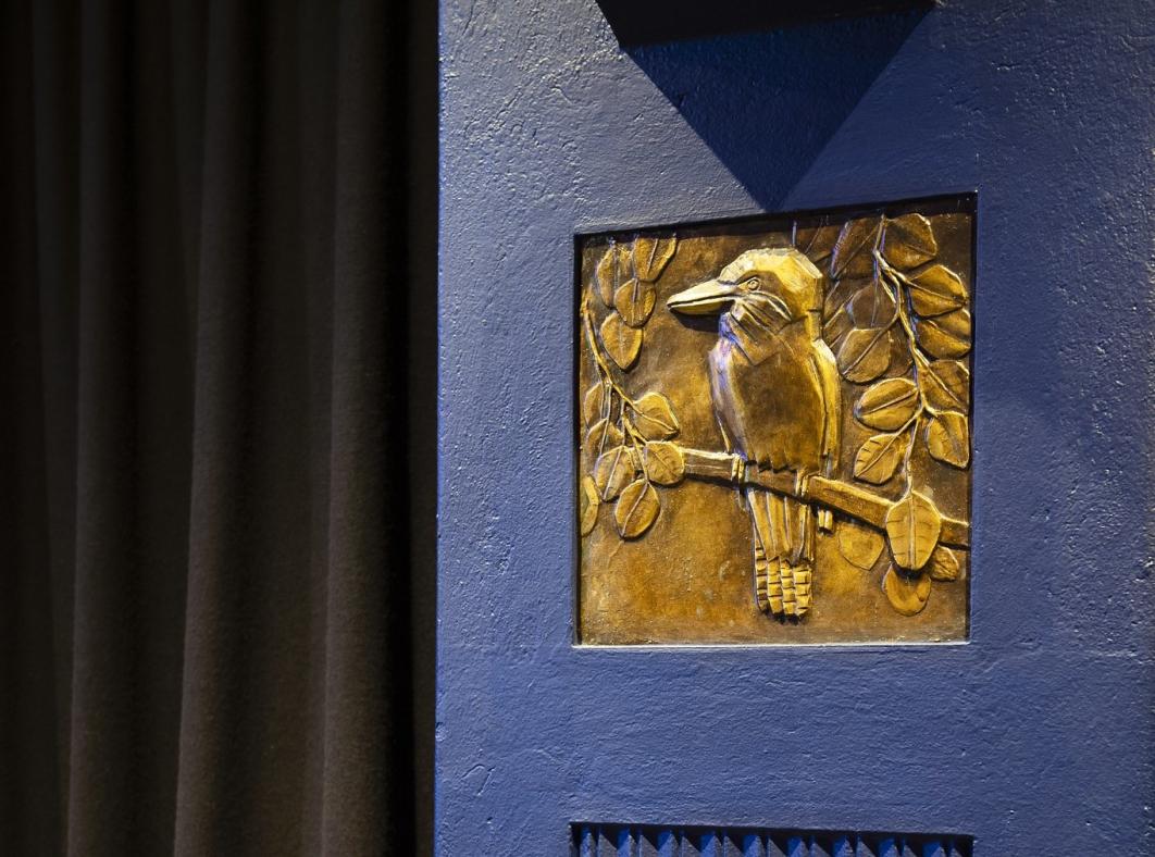 Image of golden Kookaburra decal on walls of the Arc Cinema