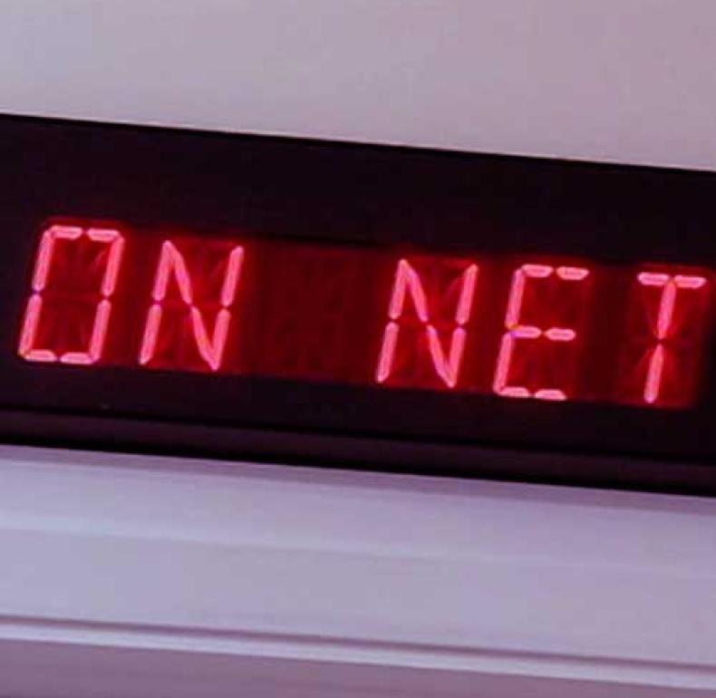 A digital red sign on a wall that reads 'ON NET'