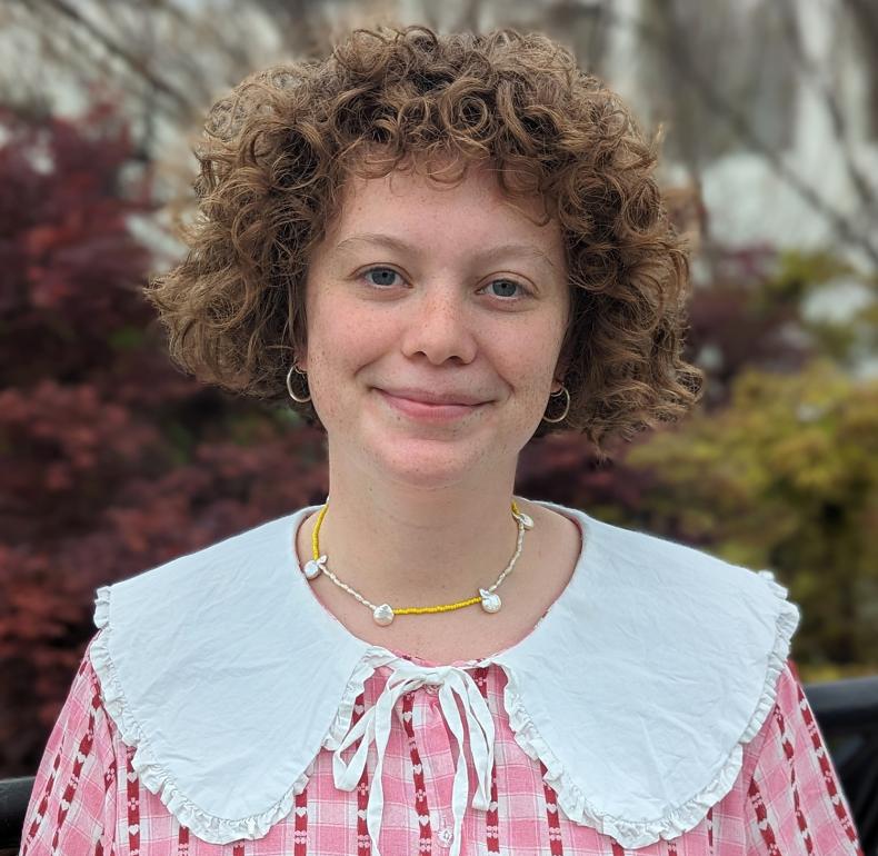 NFSA Curator Johanna McMahon wearing a pink shirt with a white collar and smiling