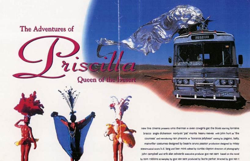 Image of bus travelling across desert with drag queen on top in large, flowing silver costume. Three drag queens in bottom left hand corner.