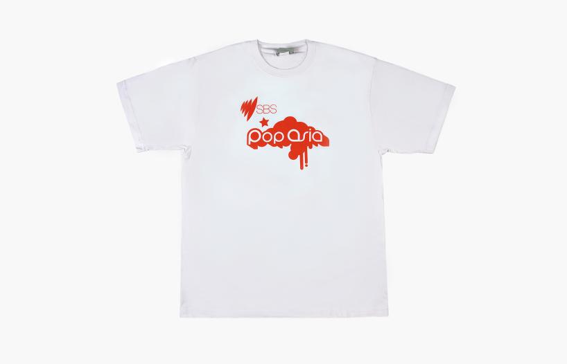 A white t-shirt with an orange logo on it that says SBS PopAsia