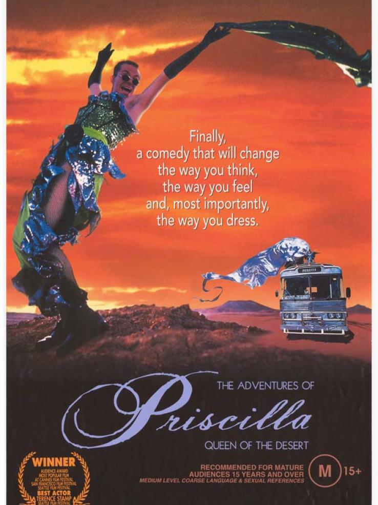  Main image has orange background colour and depicts Male in female drag. Text reads: 'Finally, a comedy that will change the way you think, the way you feel and, most importantly, the way you dress'.