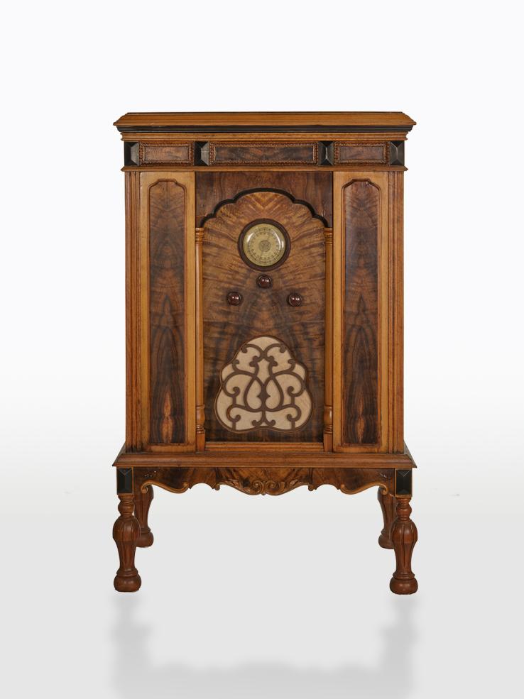 Radio receiver, c1920s, housed in an ornate wooden box.