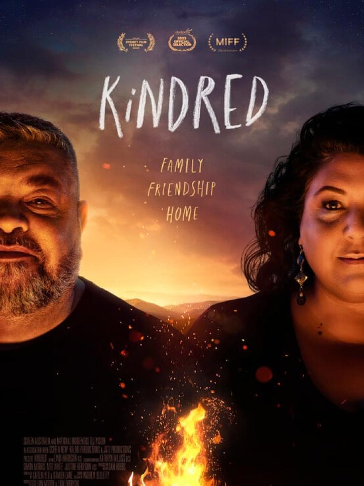A poster for the film Kindred showing First Nations filmmakers Adrian Wills and Gill Moody with a fire burning between them