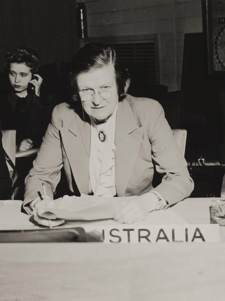 Jessie Street seated behind a desk with an Australia nameplate at an international conference