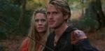 A young woman and man pictured from the shoulders up in a forest, they are dishevelled and have dirt on their faces.