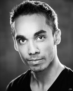 Black and white headshot of Guy Simon