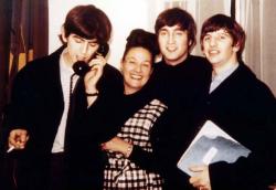 Binny Lum surrounded by all the members of The Beatles Binny Lum surrounded by all the members of The Beatles