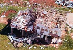 Overhead photo of a destroyed house. Overhead photo of a destroyed house.