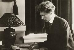 Percy Grainger writing at a desk Percy Grainger writing at a desk