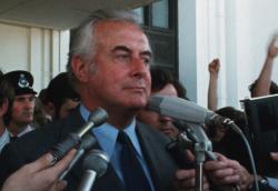 Gough Whitlam on the steps of Parliament House speaking into media microphones. Gough Whitlam on the steps of Parliament House speaking into media microphones.