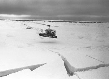 Photo of a helicopter landing on an ice flow