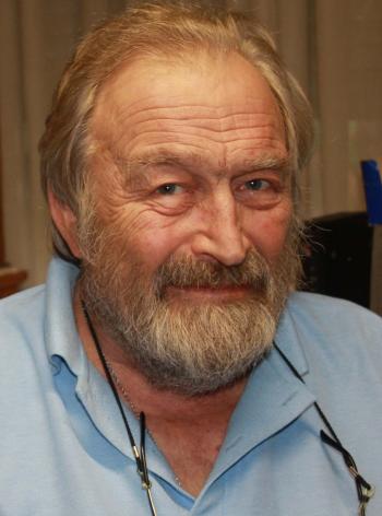 Head and shoulders portrait of Roger Dunn looking into camera. Head and shoulders portrait of Roger Dunn looking into camera.