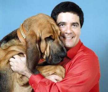 Simon Townsend and his dog Woodrow facing camera and smiling
