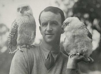 Naturalist David Fleay with a bird on his shoulder and another sitting on his hand Naturalist David Fleay with a bird on his shoulder and another sitting on his hand
