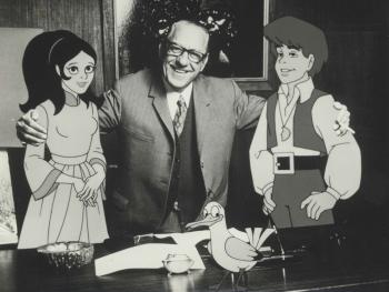 Animator Eric Porter posing with characters from 'Marco Polo versus the Red Dragon'
