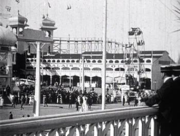 Luna Park in Melbourne. A rollercoaster at Luna Park in Melbourne. People are standing in the foreground in clothes that date it as early 1900s.