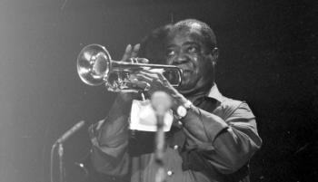 Louis Armstrong playing the trumpet, 1964.