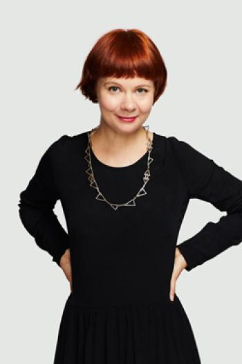 NFSA Chief Curator Meagan Loader wearing a black outfit and standing with her hands on her hips