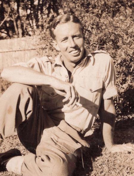 Composer James Joseph White seated on the grass and smoking a cigarette Composer James Joseph White seated on the grass and smoking a cigarette