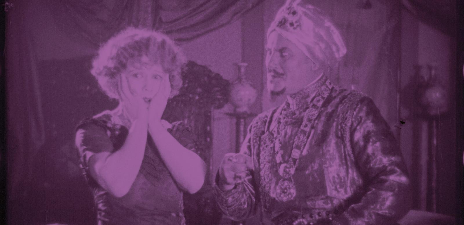 Frame capture from the 1924 film Three Days to Live showing a turbaned man next to a startled woman