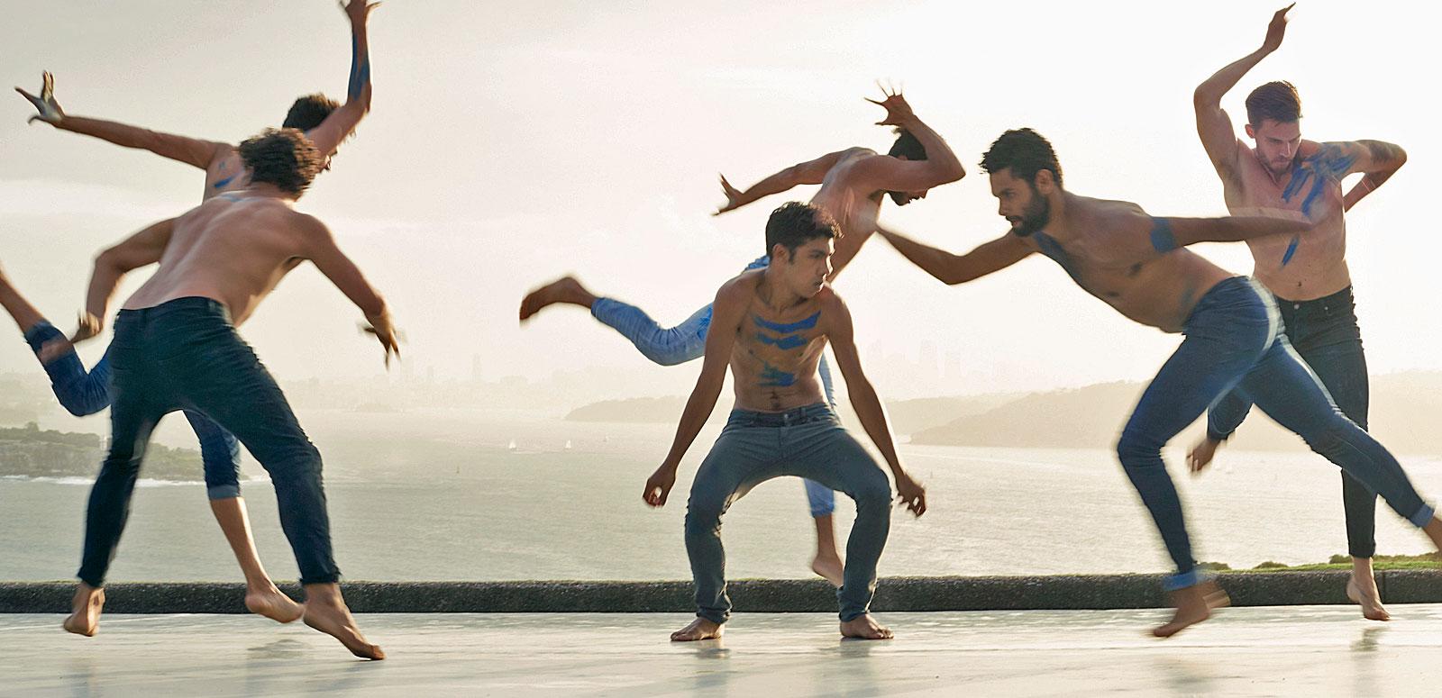Still from the film Spear showing a group of six young Aboriginal men performing a traditional dance.