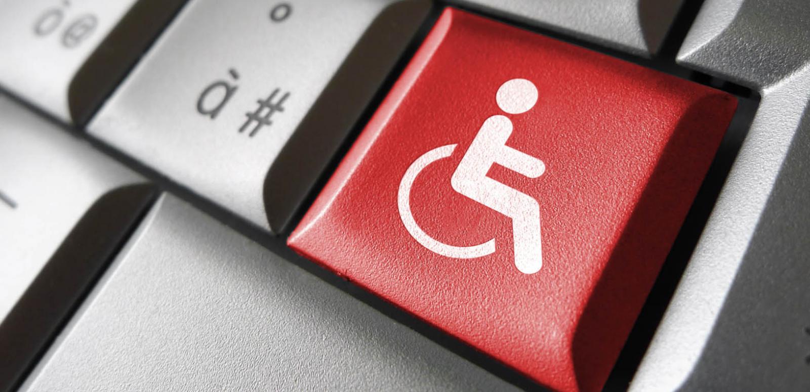 Black computer keyboard with white letters, featuring a red key with a white wheelchair outline and the words 'Accessibility' printed on the key.