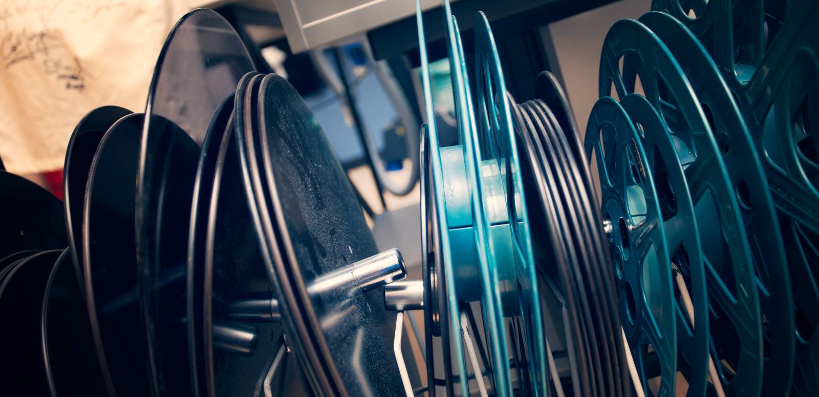 Film cans sitting within shelving