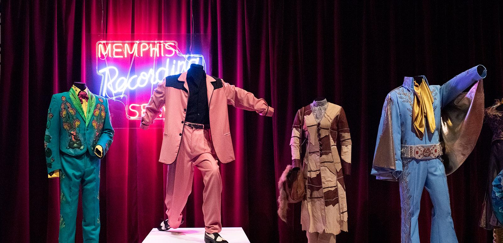 Film costumes on mannequins in an exhibition space