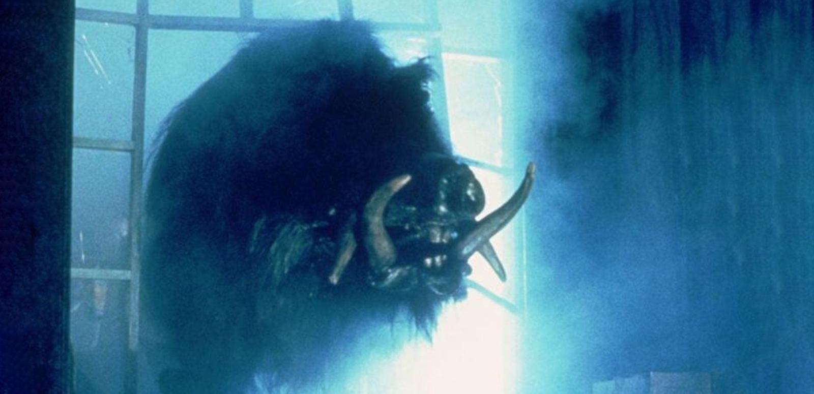A giant boar bursts through a glass panelled window.