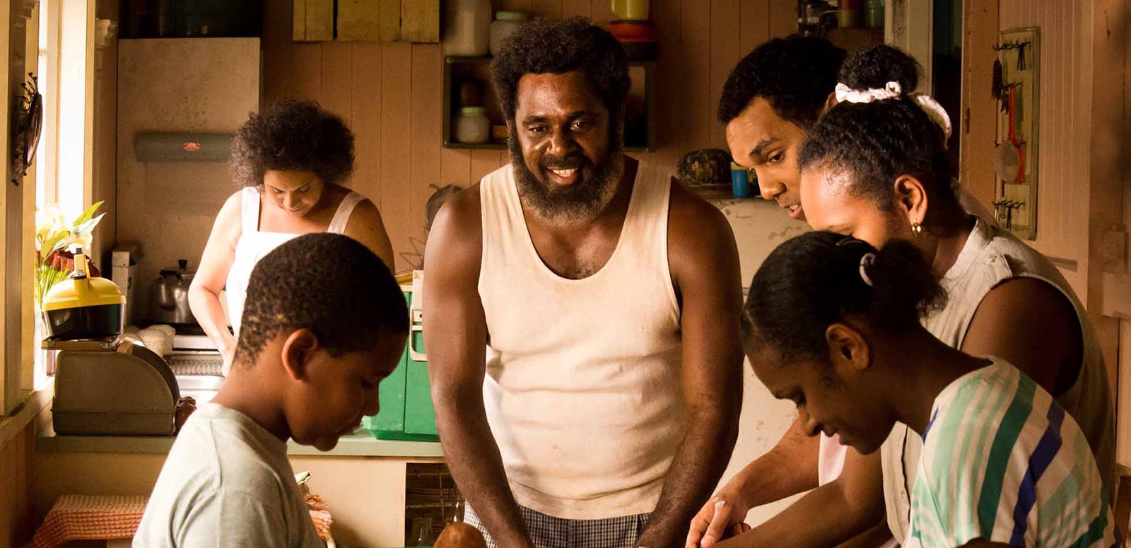 A family at home in their kitchen in a scene from the film Mabo.