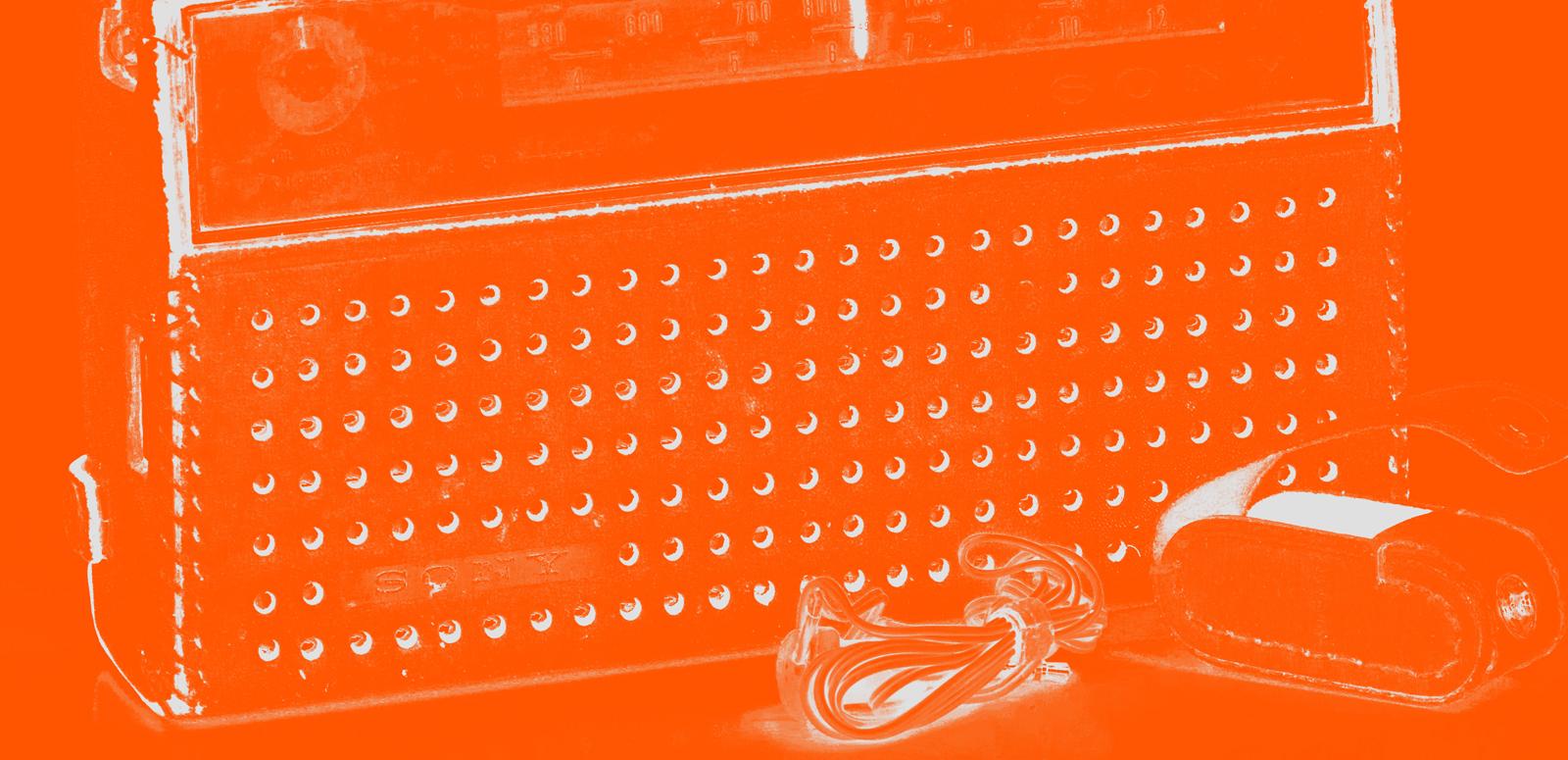 Close crop image of old radio with orange filter