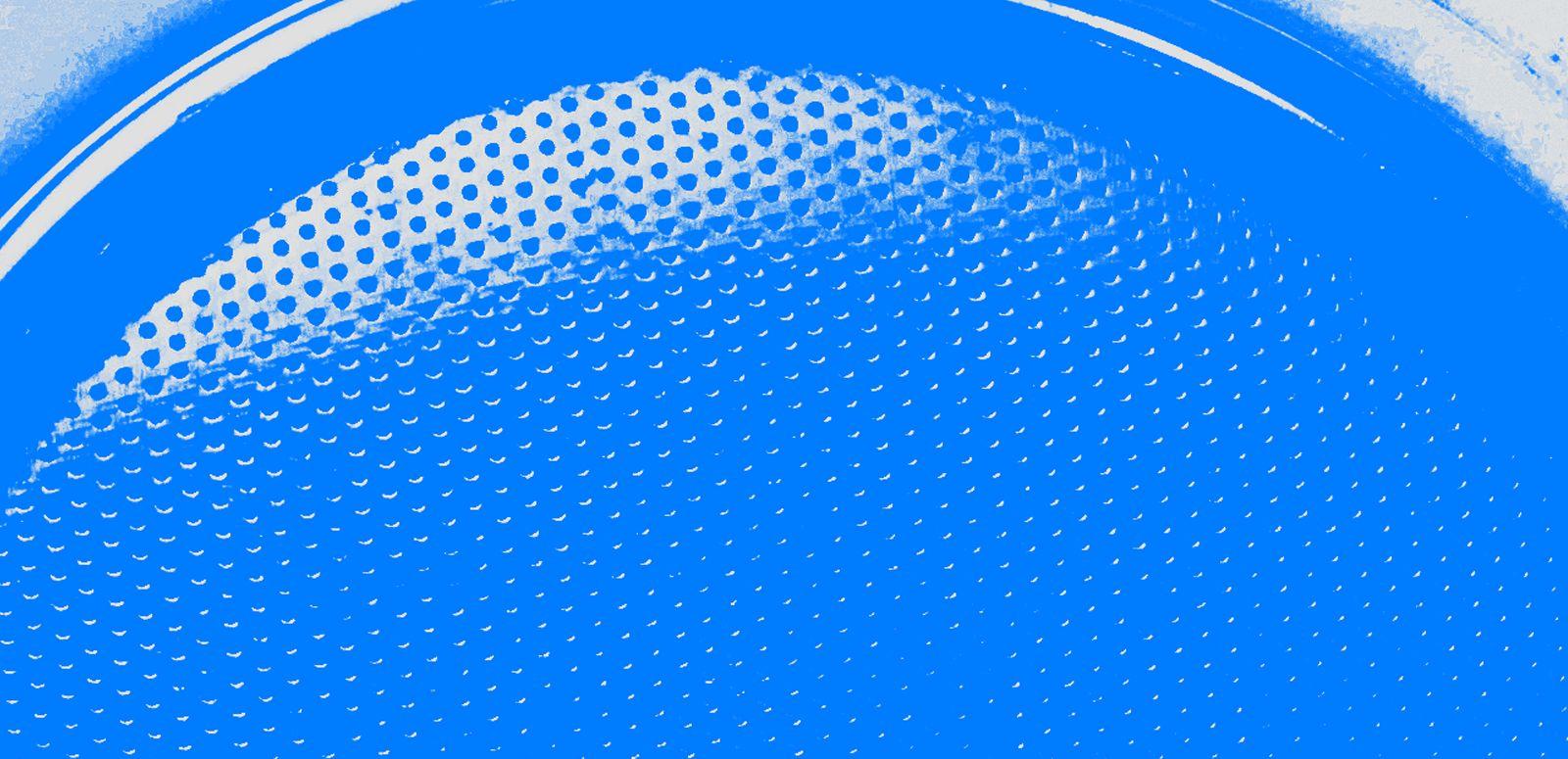 Stylised detail of a hi-fi speaker in close-up and tinted blue