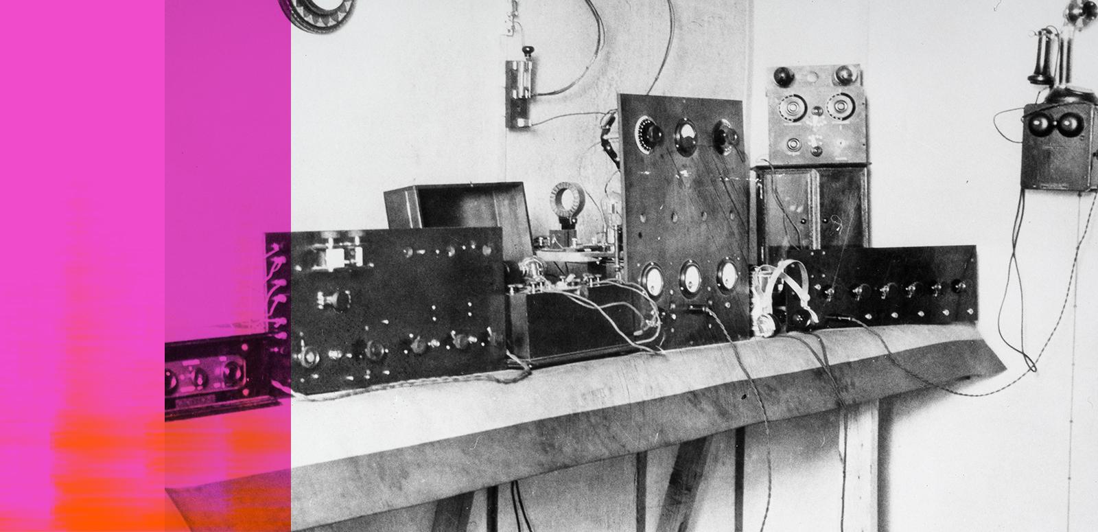 A bank of early radio equipment from the 1920s arrayed on a table