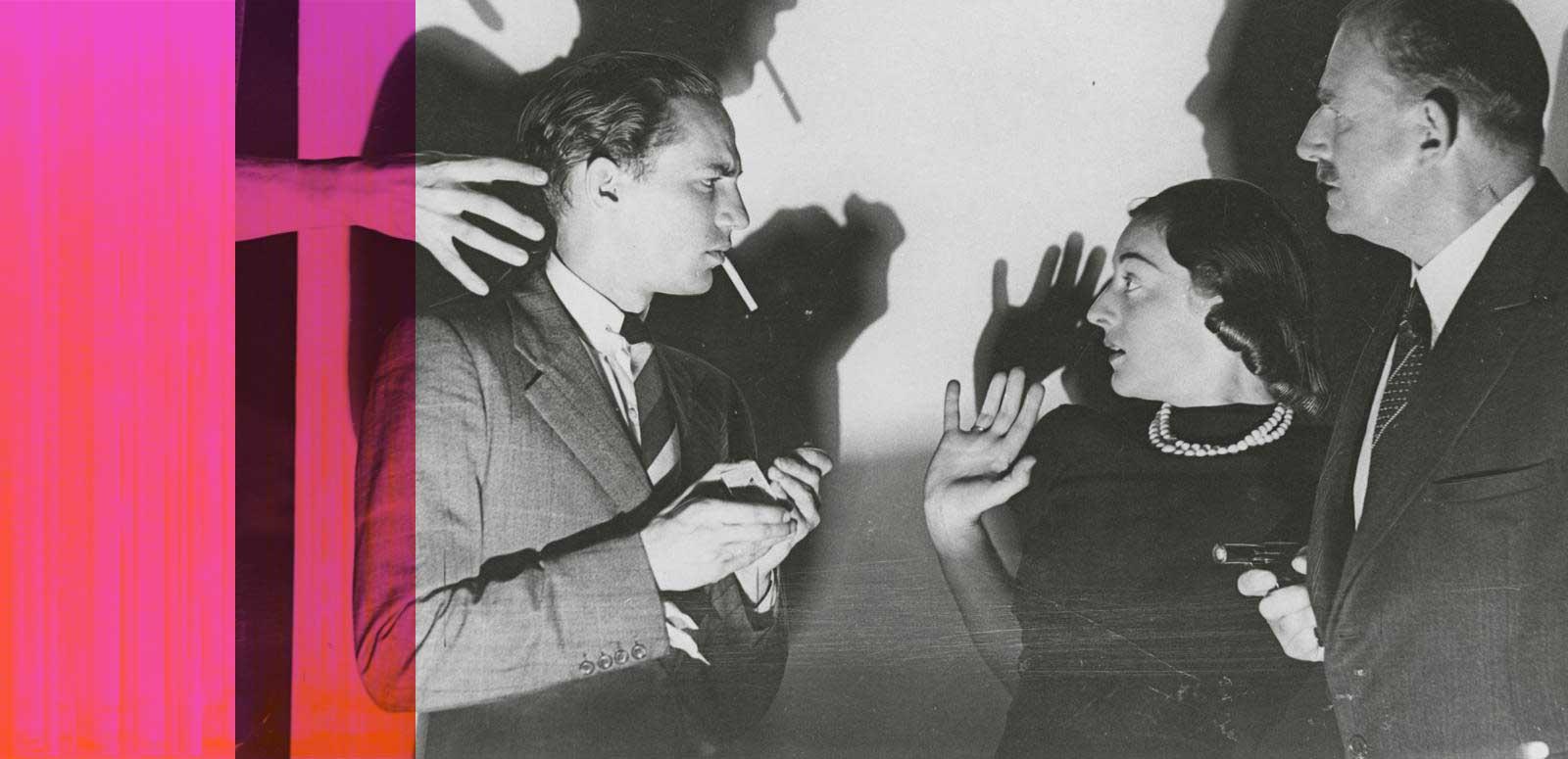 Peter Finch standing with a young woman and older man in profile. There are some menacing shadows behind them and the woman looks frightened.