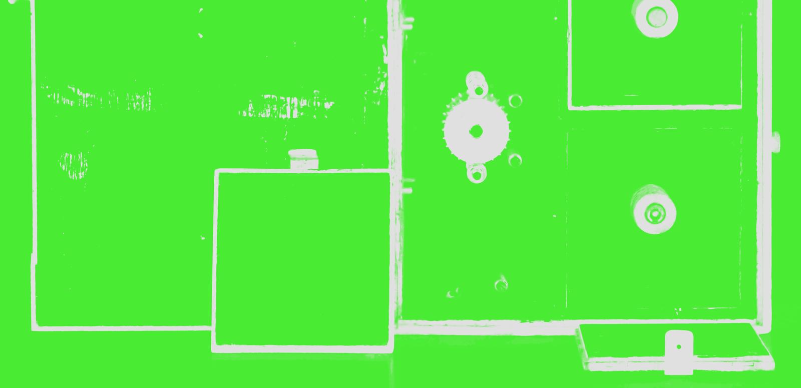 An abstracted close-up view of audio equipment that has been tinted bright green