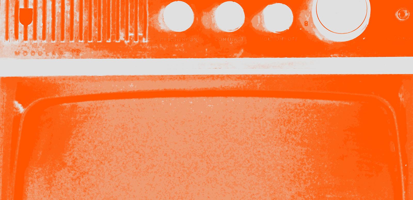 A close-up image of a radio speaker and dials that has been tinted orange