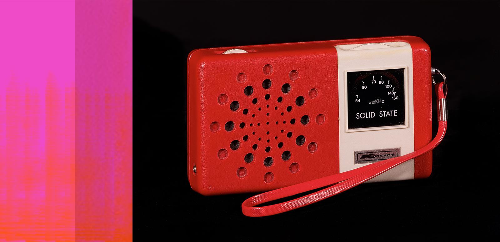 A red kmart branded portable radio with a wrist strap.