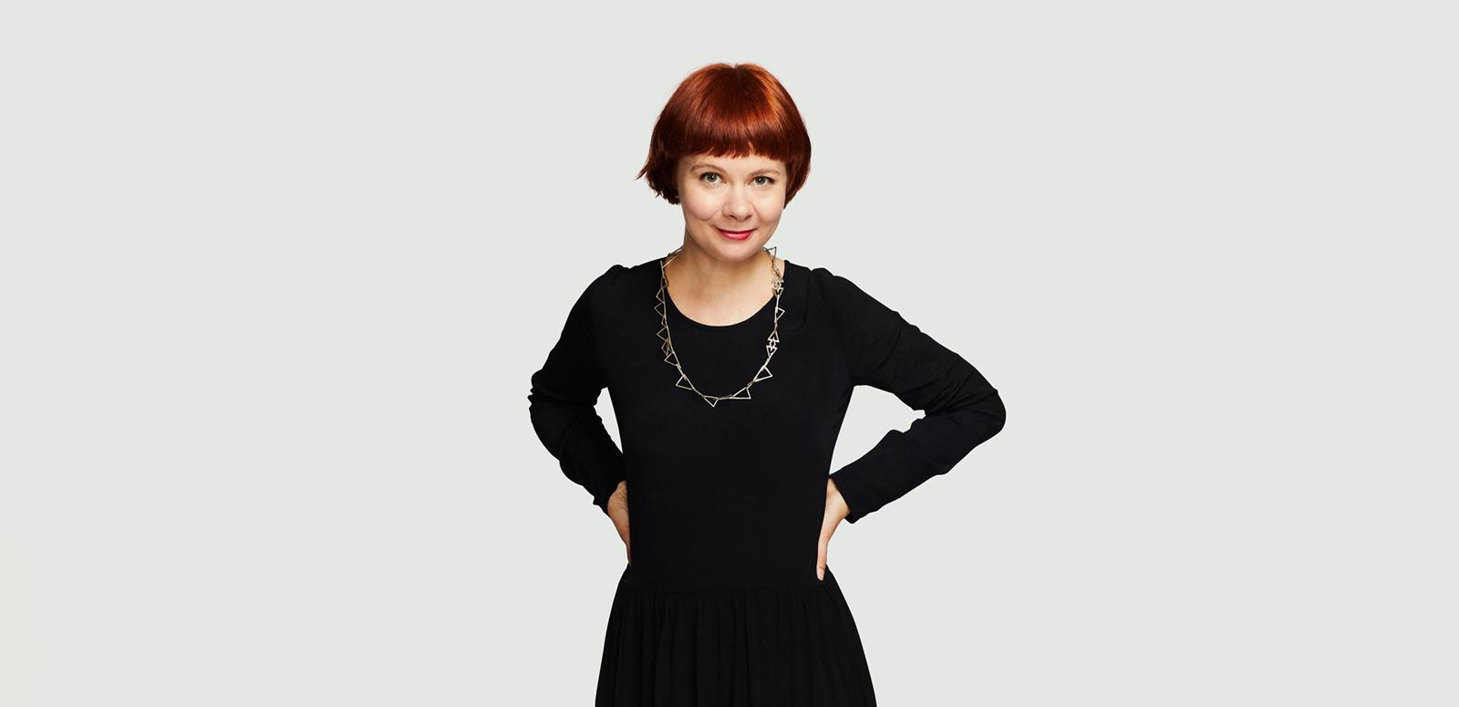 Meagan Loader wearing a black outfit with her hands resting on her hips