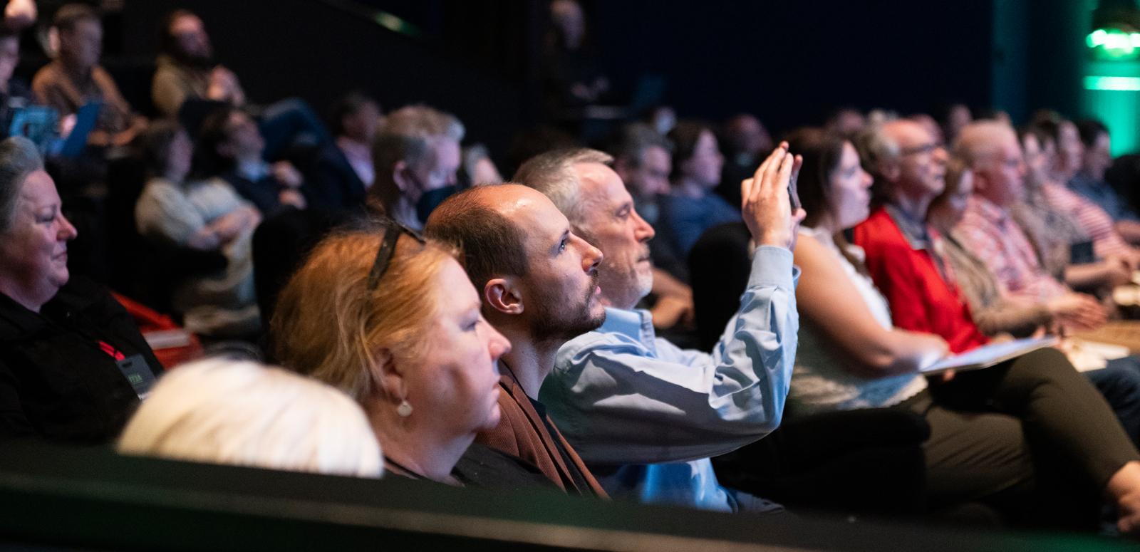 Audience watching a conference