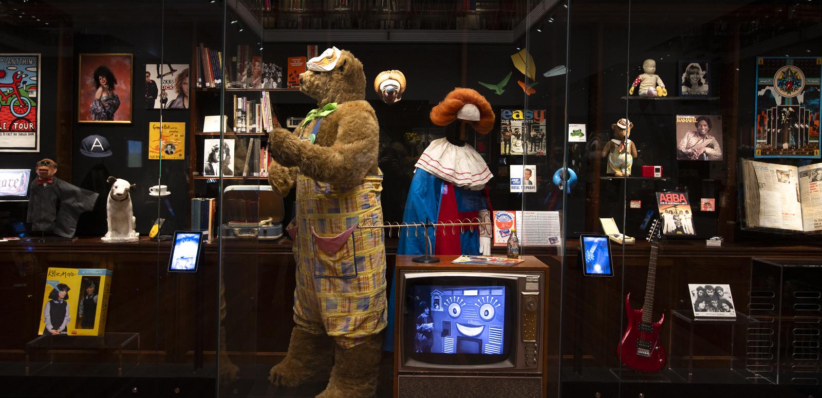 The costumes for children's TV characters Fredd the Bear and Bobo the Clown on display in a glass case at the NFSA.